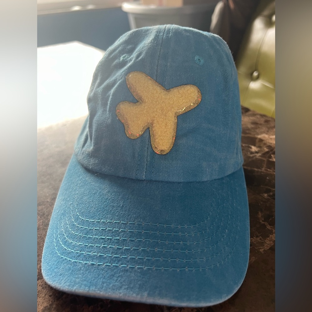 Bright blue ball cap with yellow plane patch. Perfect travel day hat! New